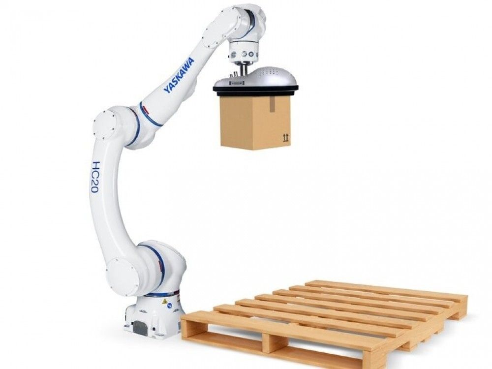 Bras robotisé manipulant un carton au-dessus d'une palette, destiné aux opérations de manutention et de palettisation